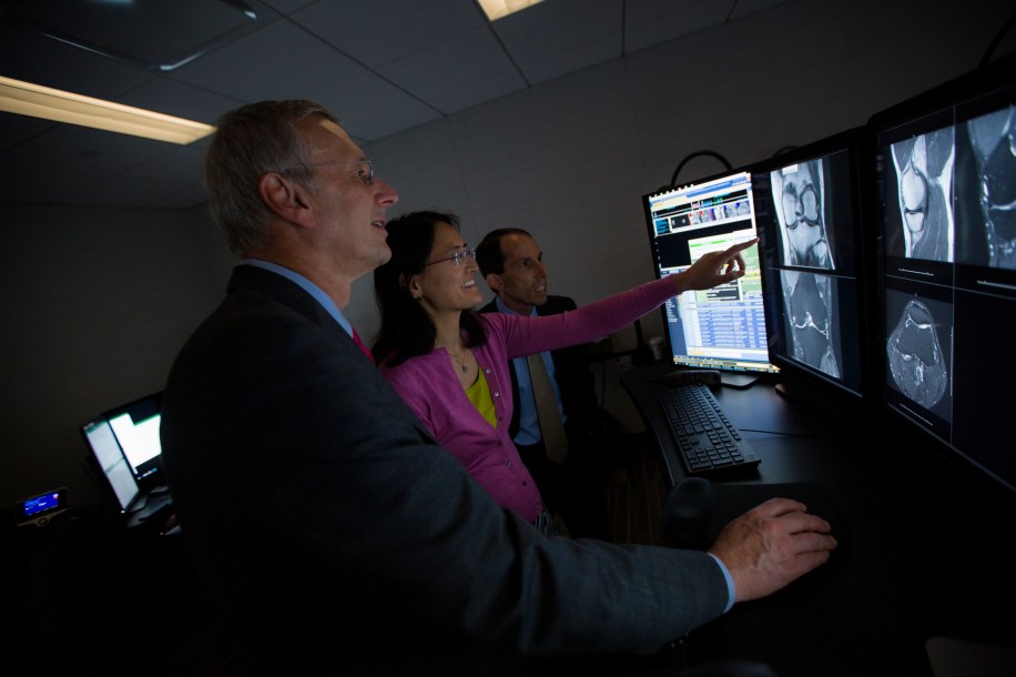 NYU School of Medicine’s Department of Radiology chair Michael Recht, MD, Daniel Sodickson, MD, vice chair for research and director of the Center for Advanced Imaging Innovation and Yvonne Lui, MD, director of artificial intelligence, examine a knee MRI at NYU Langone Health in August, 2018. Radiologists from NYU School of Medicine will be embarking on a research collaboration with Facebook to speed up MRI by up to 10 times faster through artificial intelligence.